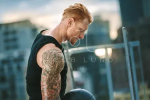 Close up of a fitness man doing workout with a medicine ball